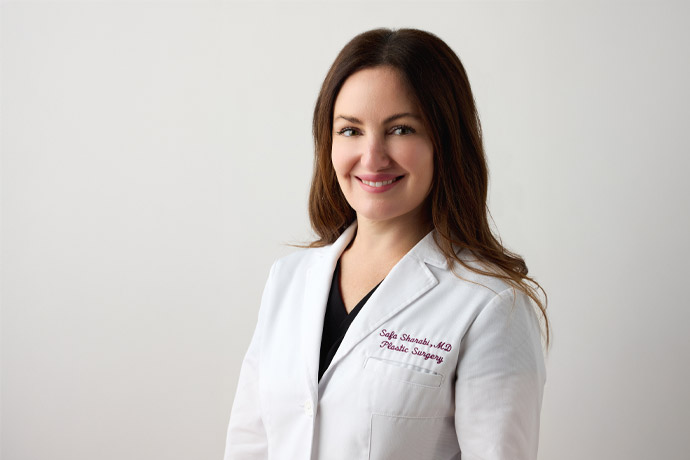 Dr. Safa Sharabi in a white lab coat